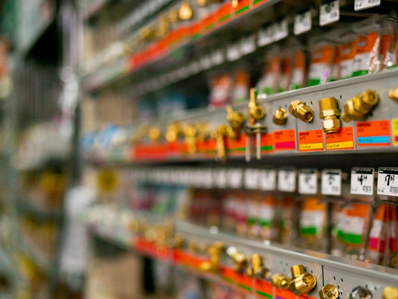 Plumbing fittings on hardware store shelves