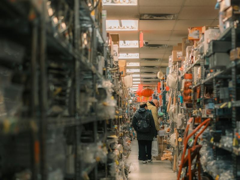 Shoppers browsing a packed store aisle