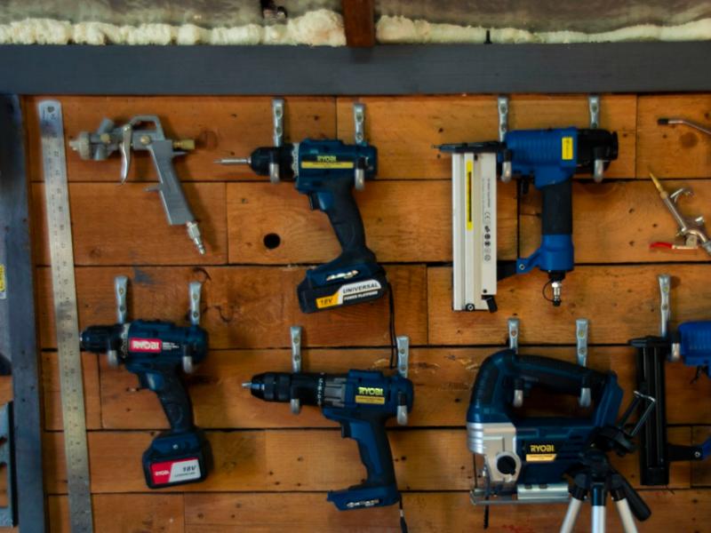 Cordless power tools on a wall rack